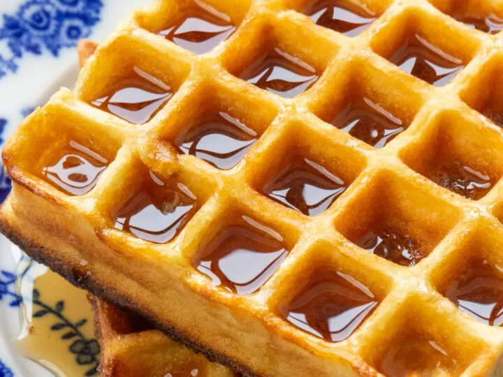 A close up of a low carb waffle on a blue plate.
