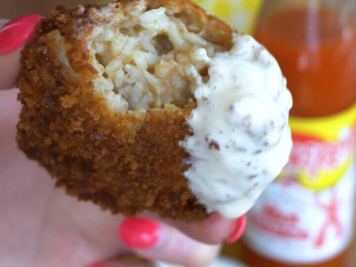 A fried gumbo ball dipped in ranch dressing