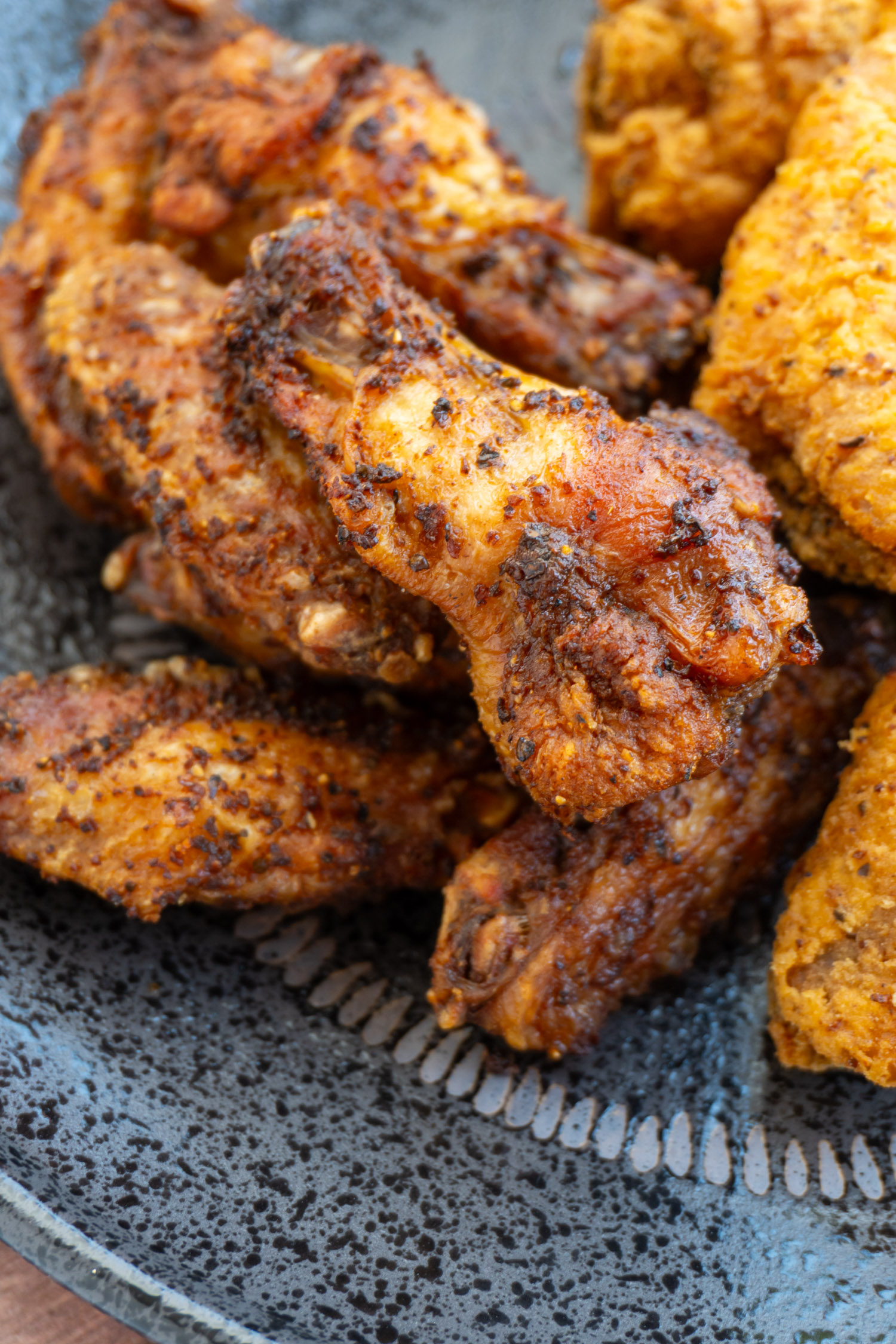 Delicious chicken wings up close, showing the seasoning dry rub.