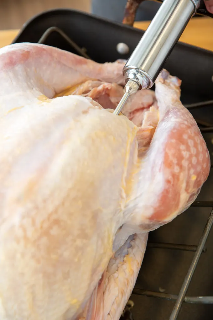 a turkey breast being injected 