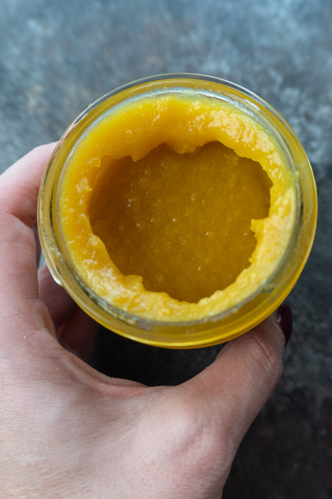 Inside of the jar is a yellow paste