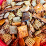 a close up container of prepared classic chex mix