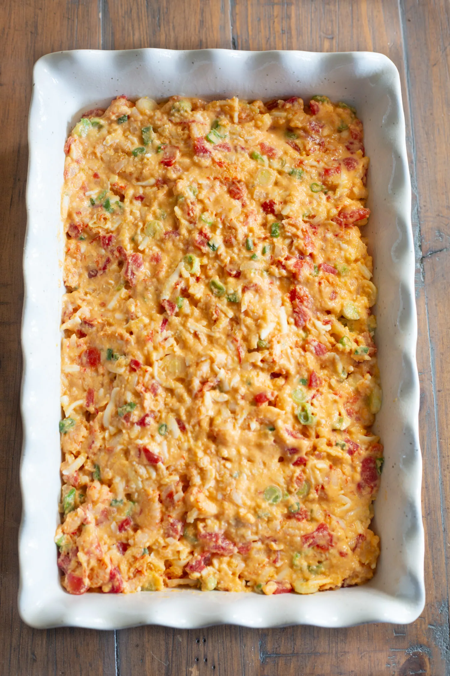 A large baking dish full of the raw batter, ready to go into a hot oven. 