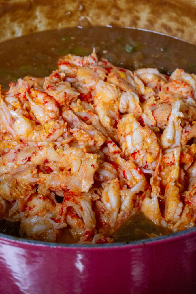 Add the crawfish to the rich flavorful sauce.