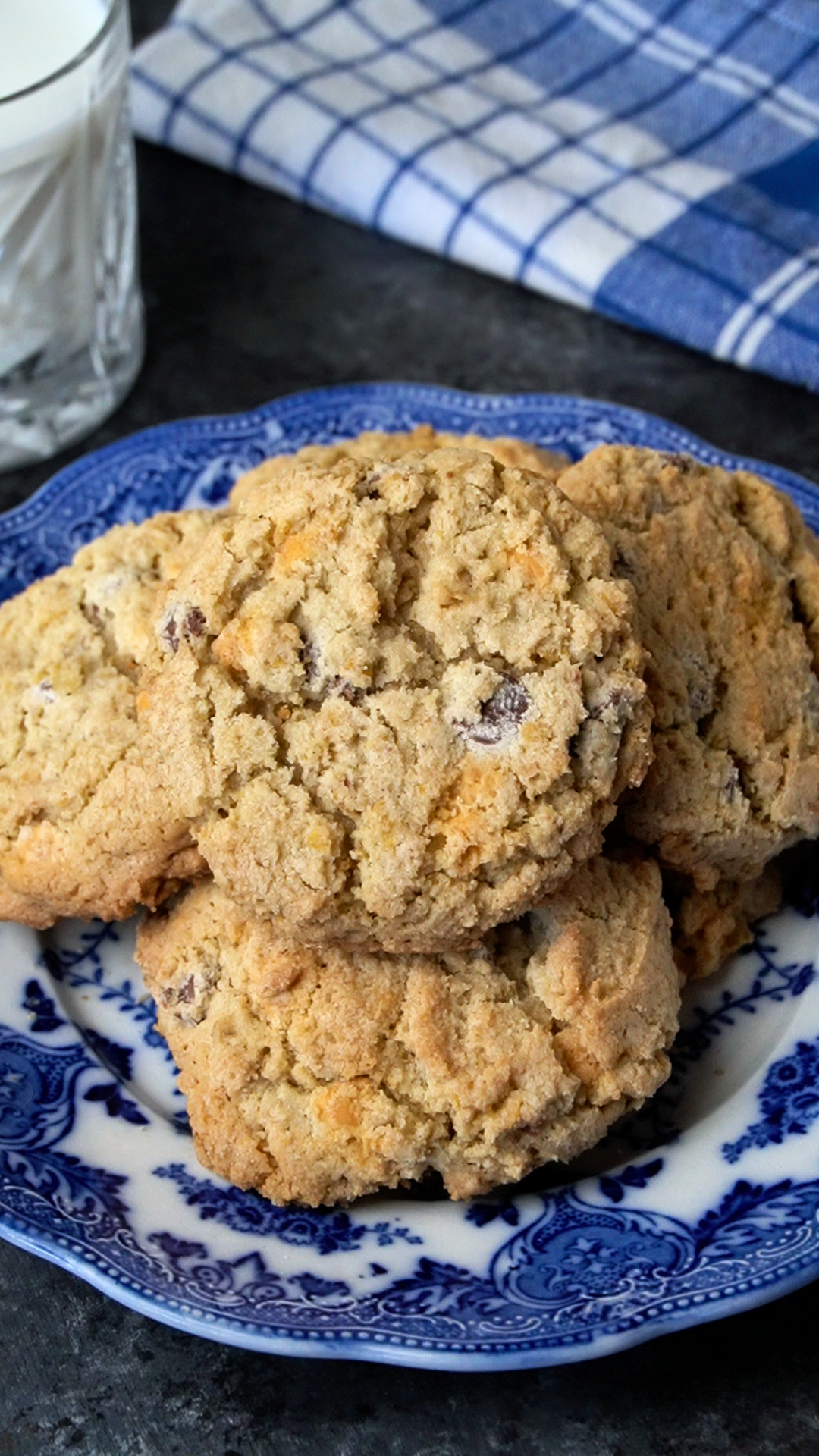 a pile of cooked cowboy cookies sitting on a decorative plate