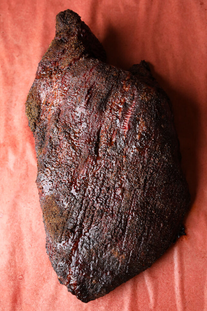 A freshly barbecued brisket sprayed with tallow about to be wrapped in butcher paper. 