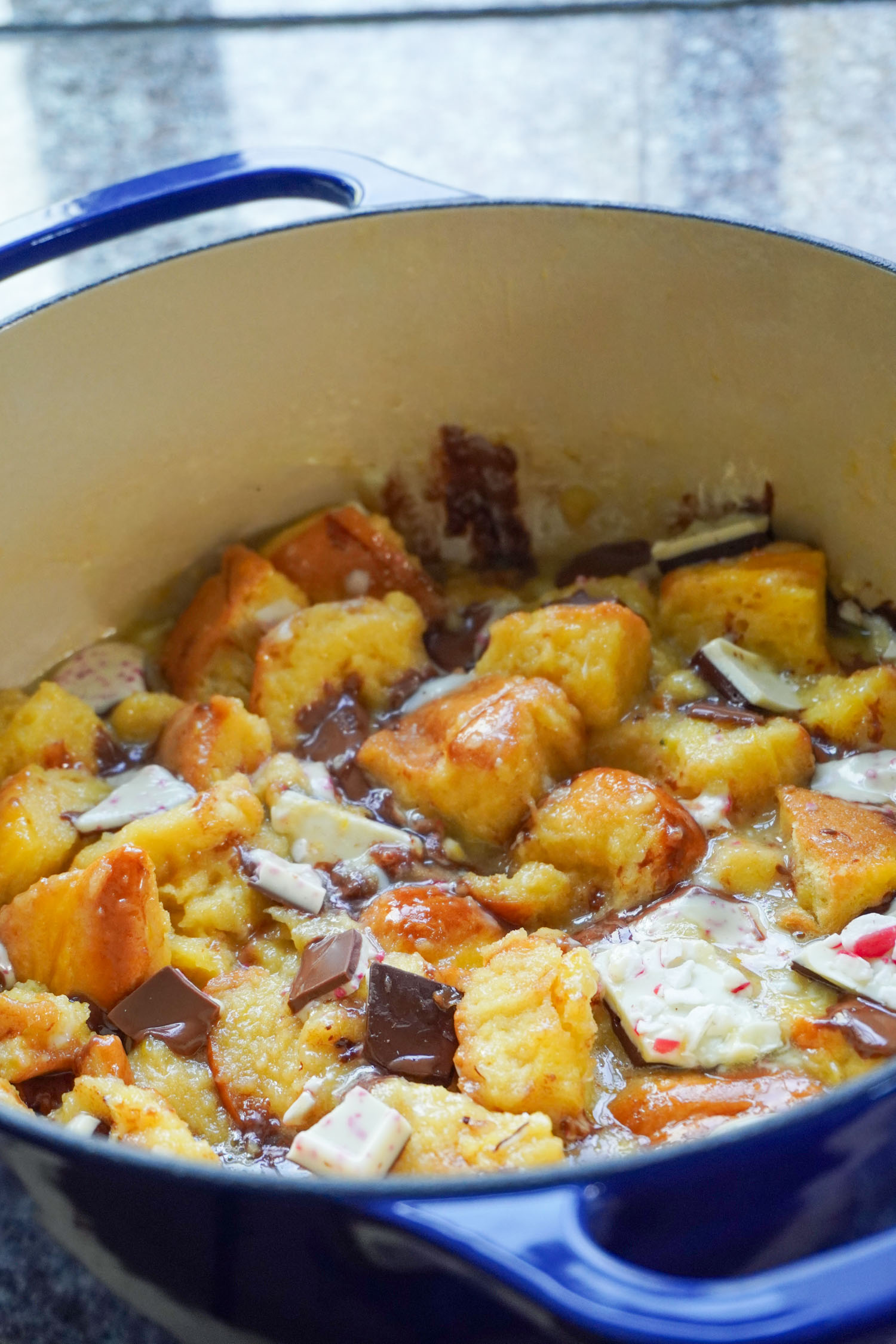 A christmas bread pudding in a large dutch oven.