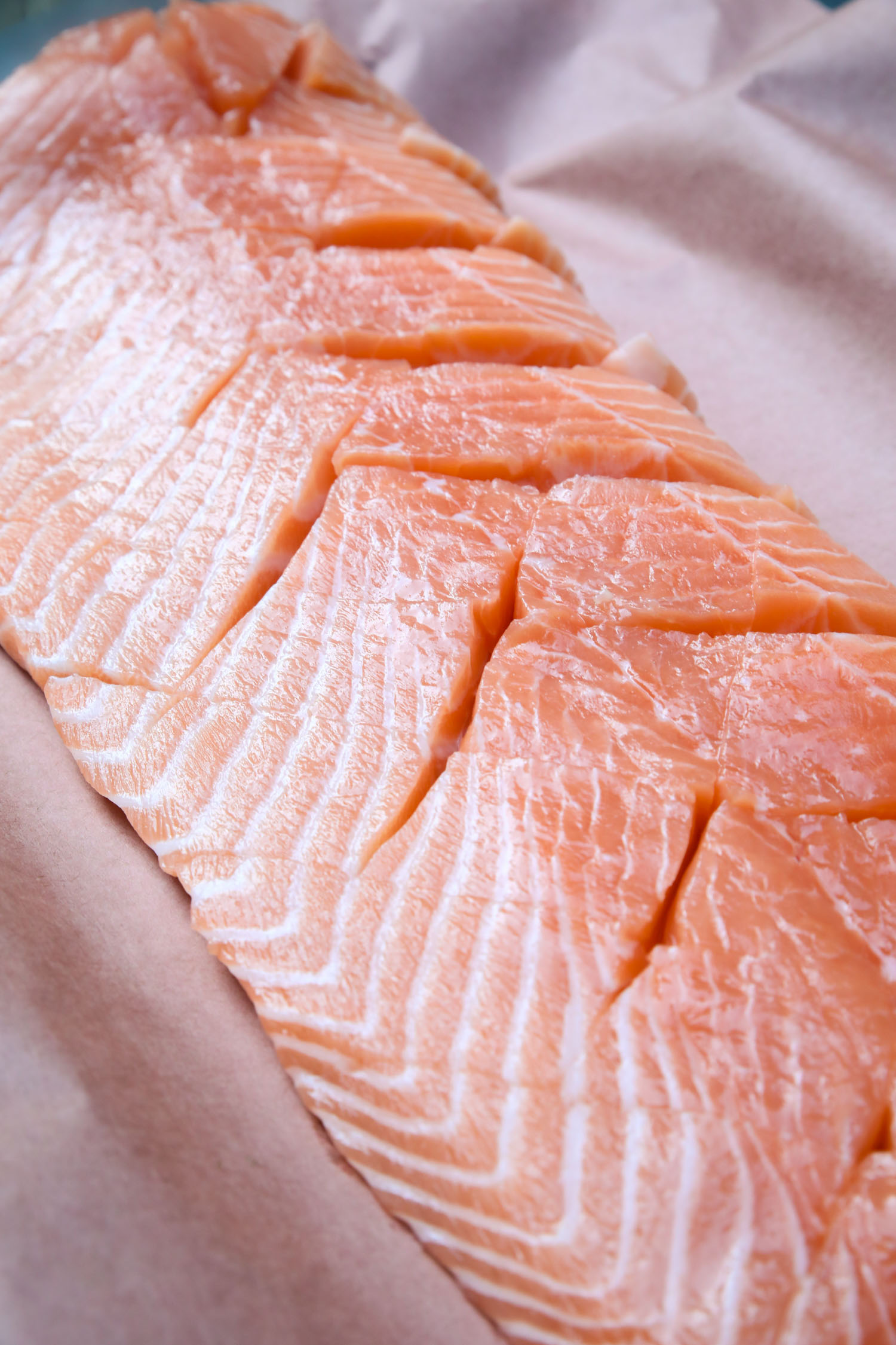 raw salmon cross-hatched for sauce permeability 
