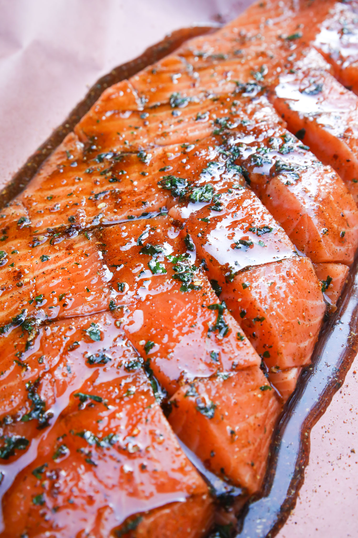 raw glazed salmon on butcher paper, ready for the smoker