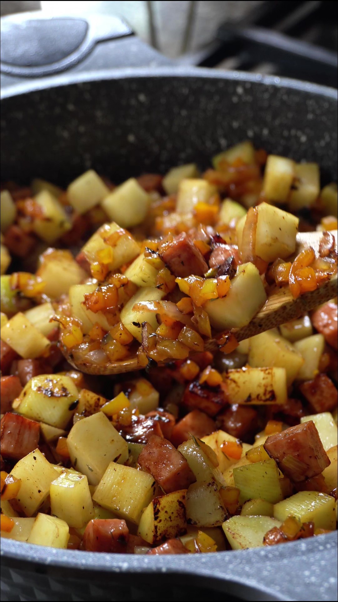 a spoonful of all of the ingredients including potato added