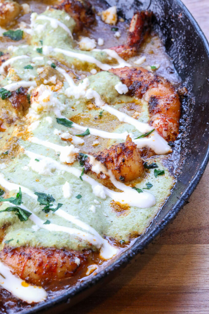 A close up of shrimp poblano in the cast iron skillet
