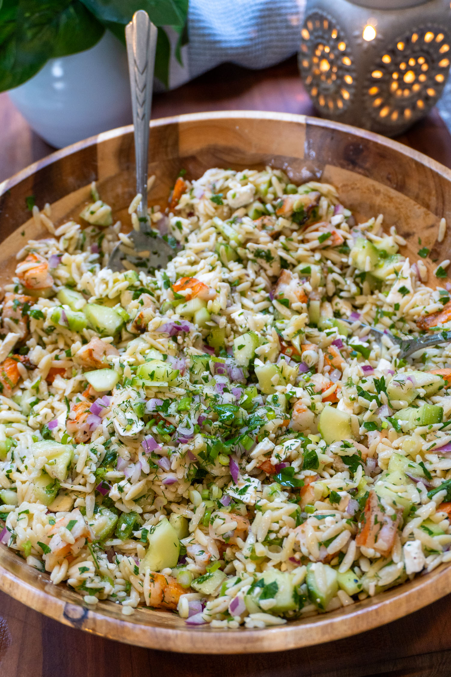 a big bowl of orzo combined with fresh herbs and shrimp