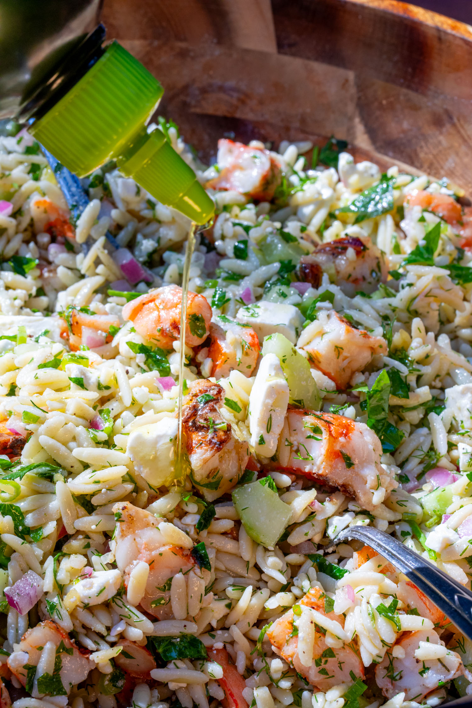 olive oil drizzled on the orzo shrimp salad