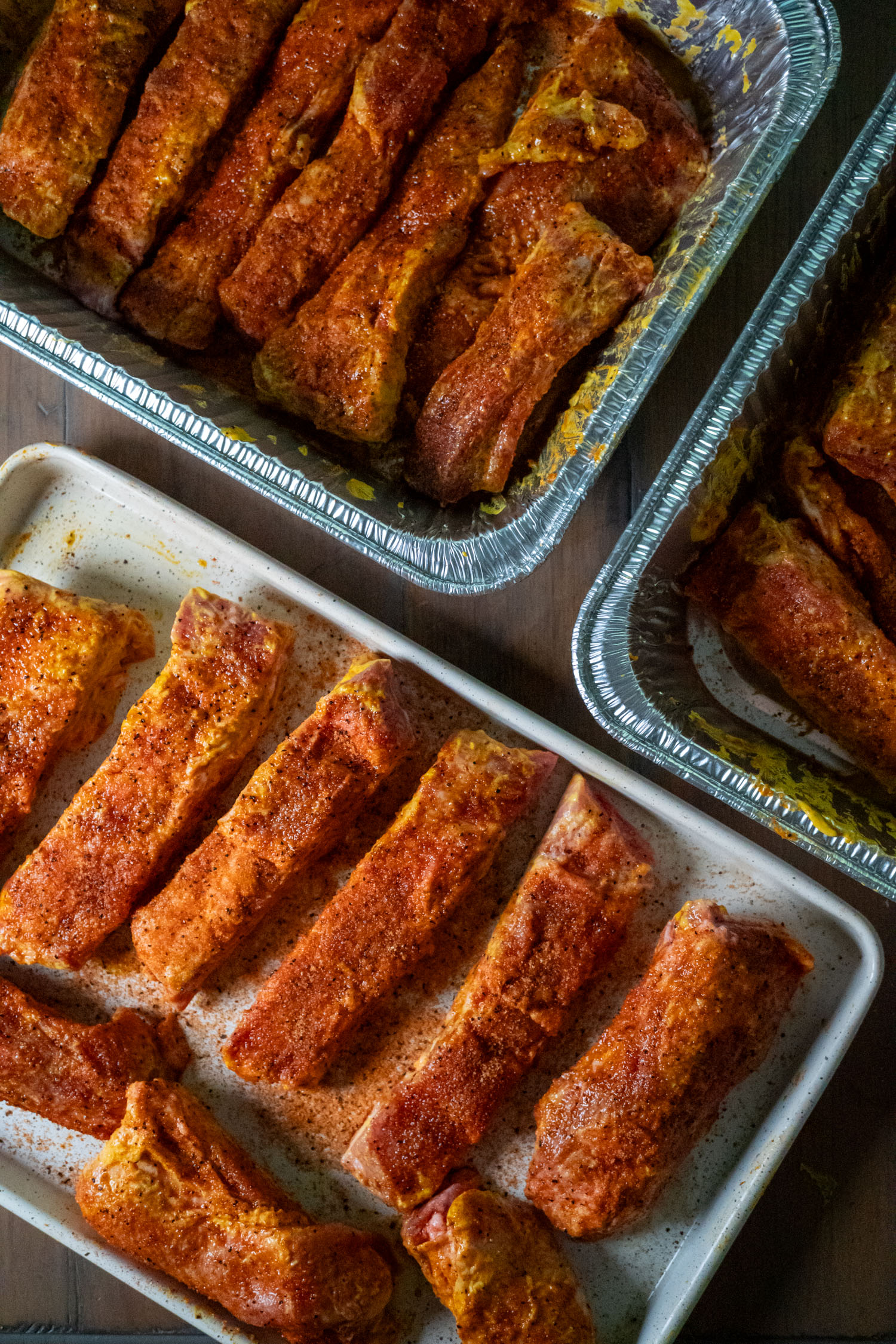 Pans of seasoned riblets