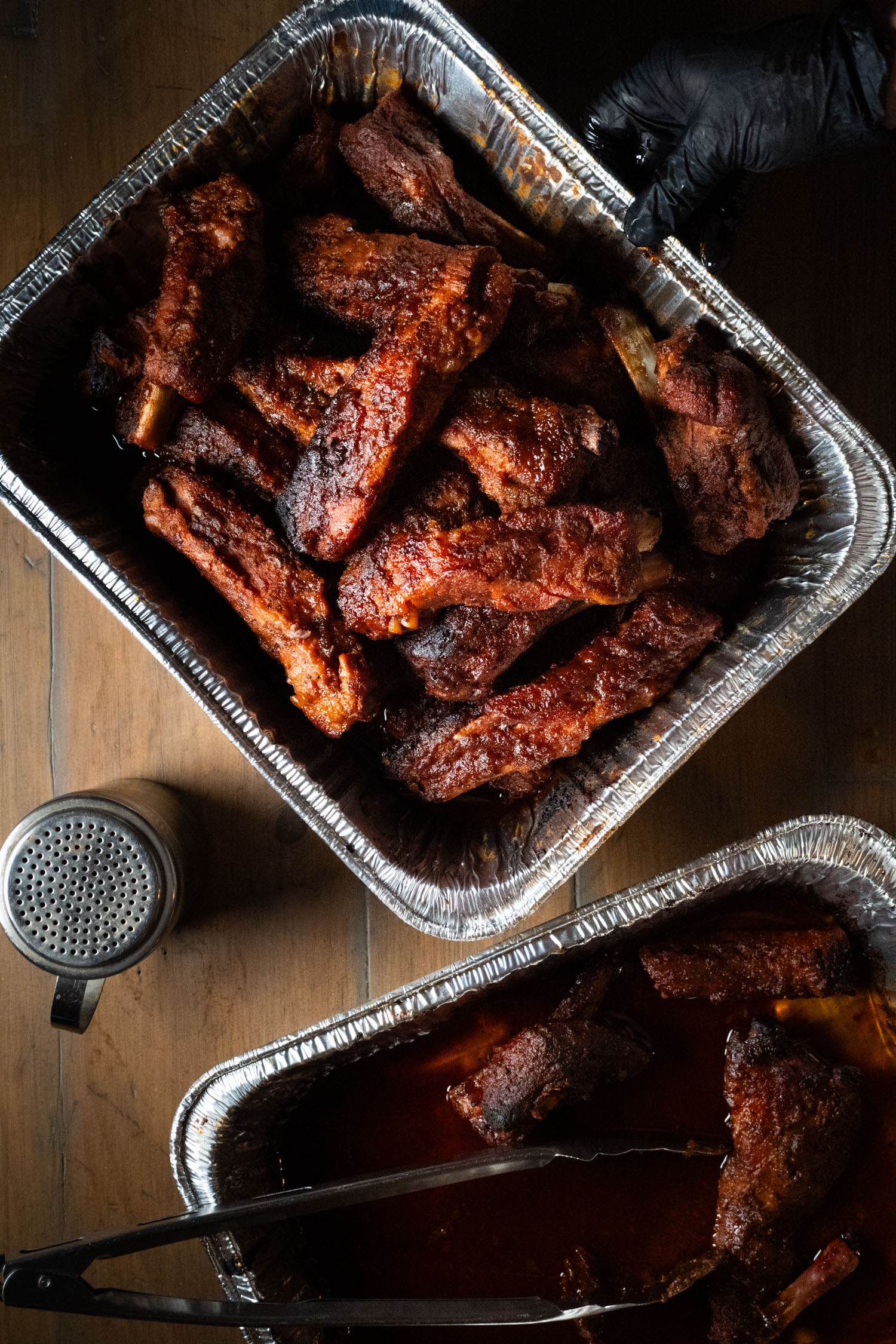 A platter full of cooked succulent party ribs loaded with flavor!
