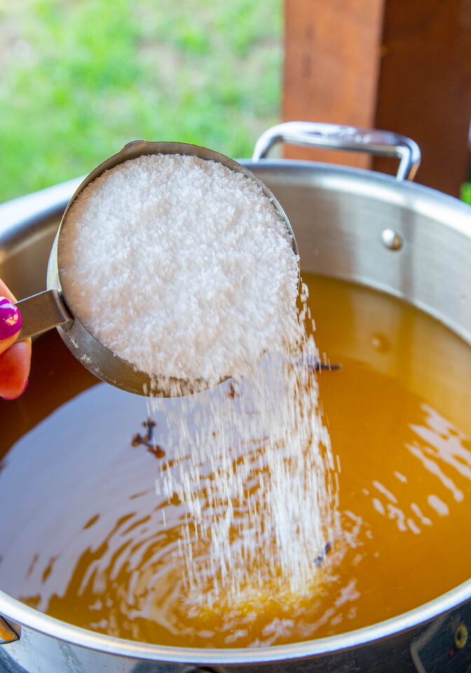 Salt being poured into the brine brew.